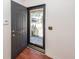 A view of the front door, number 1452, with a screen door and glass, looking out at the front yard at 1452 Glencoe Dr, Mount Pleasant, SC 29464