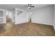 Spacious living room featuring wood-look floors, a ceiling fan, and a staircase at 146 Summit View Dr, Summerville, SC 29486