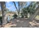 The serene backyard features mature trees and lush greenery along the beautiful waterfront at 15 Back Ct, Isle of Palms, SC 29451