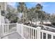 This balcony offers a beautiful view of the community, landscaping and tennis court at 15 Back Ct, Isle of Palms, SC 29451