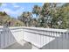 Balcony view featuring white railings and lush trees in the distance at 15 Back Ct, Isle of Palms, SC 29451
