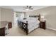 Bedroom with a ceiling fan, a dark wood bed frame, and a balcony entrance at 15 Back Ct, Isle of Palms, SC 29451