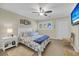 Comfortable bedroom with ceiling fan, TV, and nautical-themed decor at 15 Back Ct, Isle of Palms, SC 29451