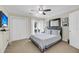 Cozy bedroom with closet, balcony, ceiling fan, comfortable bed, and flatscreen TV at 15 Back Ct, Isle of Palms, SC 29451