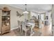 Light-filled dining area with a coastal design, wooden table set, and decor for a relaxed meal at 15 Back Ct, Isle of Palms, SC 29451