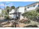 Charming exterior view showcasing white siding, a quaint balcony, and convenient garage access at 15 Back Ct, Isle of Palms, SC 29451