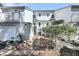 Exterior side view of the building showing the stairs leading to the unit at 15 Back Ct, Isle of Palms, SC 29451