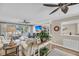 Cozy living room features hardwood floors, ceiling fan, and access to the outdoor patio at 15 Back Ct, Isle of Palms, SC 29451