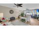 Inviting living room with ceiling fan, hardwood floors, and patio access at 15 Back Ct, Isle of Palms, SC 29451
