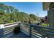 Scenic balcony with a view of lush trees, a pool and beautiful surroundings for enjoying the outdoors at 1529 Red Drum Rd, Mount Pleasant, SC 29466