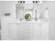 Bathroom featuring double sinks, a large mirror, and decorative accents at 158 Sandshell Dr, Charleston, SC 29492