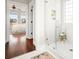 Bright bathroom with glass enclosed shower and doorway view to the main bedroom at 158 Sandshell Dr, Charleston, SC 29492