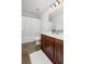Well-lit bathroom features a white vanity countertop, wood cabinets, and ceramic tile flooring at 158 Sandshell Dr, Charleston, SC 29492