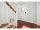 Bright foyer featuring hardwood floors, staircase with wooden accents, and a view to the front door, creating a grand entrance at 158 Sandshell Dr, Charleston, SC 29492