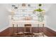 Stylish home office with custom built-ins, hardwood floors, and ample workspace at 158 Sandshell Dr, Charleston, SC 29492