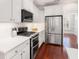 Modern kitchen with stainless steel appliances, white cabinets, and subway tile backsplash, combining style and functionality at 158 Sandshell Dr, Charleston, SC 29492
