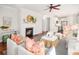 Bright, open living room features a fireplace, hardwood floors, and plenty of seating at 158 Sandshell Dr, Charleston, SC 29492
