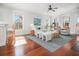 Inviting living room with large windows, hardwood floors, neutral decor, and comfortable seating at 158 Sandshell Dr, Charleston, SC 29492