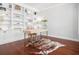 Well-lit office with custom built-in shelves, hardwood floors, and modern decor, providing a functional and stylish workspace at 158 Sandshell Dr, Charleston, SC 29492