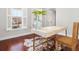 Bright office space featuring a modern desk, hardwood floors, and ample natural light, creating an inviting and productive atmosphere at 158 Sandshell Dr, Charleston, SC 29492