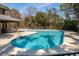 Community pool with chairs and a nearby covered area with chairs and tables at 158 Sandshell Dr, Charleston, SC 29492