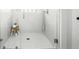 Modern walk-in shower with sleek tile work, glass enclosure, and a comfortable stool at 158 Sandshell Dr, Charleston, SC 29492