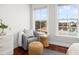 Cozy sitting area features a comfortable chair, wicker side table, and views of the water at 158 Sandshell Dr, Charleston, SC 29492