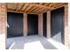 Home undercarriage featuring brick and black metal doors with a brick patio floor at 158 Sandshell Dr, Charleston, SC 29492