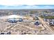 An aerial view of a coastal community featuring newly constructed homes, a lake, and recreational areas under a bright blue sky at 170 Callibluff Dr, Summerville, SC 29486