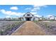 Exterior shot of the community barn with surrounding garden and landscape at 170 Callibluff Dr, Summerville, SC 29486