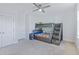 Bright bedroom features a gray bunk bed with stairs, neutral carpet and a ceiling fan at 170 Callibluff Dr, Summerville, SC 29486
