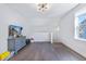 Bright bonus room featuring hardwood floors, a gray dresser and a modern lighting fixture at 170 Callibluff Dr, Summerville, SC 29486