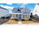 Charming two-story home with a welcoming porch and well-manicured front yard at 170 Callibluff Dr, Summerville, SC 29486