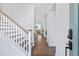 Inviting foyer with hardwood floors, staircase, and view into the living spaces at 170 Callibluff Dr, Summerville, SC 29486