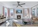 Cozy living room with a fireplace, large windows, and comfortable seating at 170 Callibluff Dr, Summerville, SC 29486