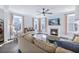 Spacious living room with a fireplace, hardwood floors, and plenty of natural light at 170 Callibluff Dr, Summerville, SC 29486