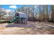 Neighborhood playground features a slide, swings, and plenty of trees for shade on a sunny day at 170 Callibluff Dr, Summerville, SC 29486