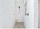 Bright and modern shower with white tiling, built-in shelving and a shower bench at 170 Callibluff Dr, Summerville, SC 29486