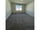 Spacious bedroom featuring plush carpeting and a window offering abundant natural light and views at 1703 Scarlett Maple St, Summerville, SC 29486