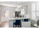 Bright kitchen with island, bar stool seating, and stainless steel appliances at 2021 Arbutus Ave, North Charleston, SC 29405