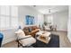 Spacious living room with ample seating, a ceiling fan, and lots of natural light at 2021 Arbutus Ave, North Charleston, SC 29405
