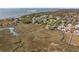 Aerial shot showcases a waterfront community with marsh views and private docks along a winding creek at 204 William St, Mount Pleasant, SC 29464