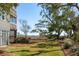 Lush backyard featuring a hammock, a well maintained lawn, and mature trees at 204 William St, Mount Pleasant, SC 29464