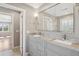 Beautiful bathroom featuring a granite double sink vanity, and brushed nickel fixtures at 204 William St, Mount Pleasant, SC 29464