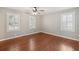 Bedroom with hardwood floors, plantation shutters, and ample natural light at 204 William St, Mount Pleasant, SC 29464