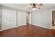 Bedroom featuring hardwood floors, a ceiling fan, and ensuite bathroom access at 204 William St, Mount Pleasant, SC 29464