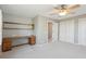 Spacious bedroom featuring a vintage desk area, ceiling fan, and ample closet space at 204 William St, Mount Pleasant, SC 29464