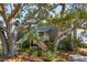 Inviting exterior with mature trees providing shade and curb appeal at 204 William St, Mount Pleasant, SC 29464