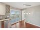 Kitchen features granite counters, a wine rack, and access to the porch at 204 William St, Mount Pleasant, SC 29464