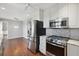 Open kitchen with stainless appliances and wood floors at 204 William St, Mount Pleasant, SC 29464